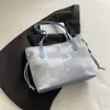 Bolsa feminina de grande capacidade para primavera e verão 2026 nova moda bolsa de ombro para o dia a dia com toque de luxo, bolsa tote tipo balde de mão