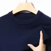 Camiseta básica de punto de color liso para hombre, suéter interior ajustado para otoño e invierno, suéter de cuello redondo para hombre, nuevo estilo moderno para otoño e invierno 2026