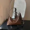 Bolsa de antebraço feminina, nova coleção outono/inverno 2026, design de alta qualidade, vintage e requintado, bolsa de ombro de grande capacidade, adequada para o trabalho e uso diário