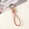 Llavero colgante de cuerda de cuero hecho a mano vintage colgante tejido cuerda para llaves de coche de piel cordón para billetera muñequera corta
