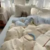 Juego de ropa de cama de textiles para el hogar de Nantong, juego de cuatro piezas, sábana de algodón lavado amigable con la piel, funda de edredón, sábana bajera, juego de tres piezas para camas de dormitorios estudiantiles