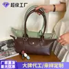 Venta al por mayor transfronteriza de bolsos pequeños para mujer, nuevos bolsos de axila con diseño de nicho vintage, bolsos de mano de moda para salir, bolsos de hombro modernos