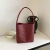 Bolso cubo tejido de estilo coreano transfronterizo para mujer, bolso texturizado, bolso de hombro simple para el día a día de verano 2026 con bolsillo interior