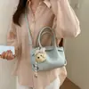 Bolsa de Mão Estilosa Individual Tendência com Cordão Textura Lichia Formato Balde Moda Primavera/Verão 2026 Versátil Ombro Transversal