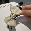 Primavera 2025 Nuevo Diseñador de Corea del Sur Pinza para el Cabello de Gasa con Lazo Pinza de Plátano de Camelia Disco para la Parte Posterior de la Cabeza Pinza para el Cabello