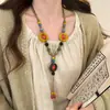Colar longo com pingente de borboleta de cerâmica estilo étnico exótico, um acessório de corrente para suéter boêmio e vintage para mulheres