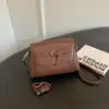 Bolso de hombro retro, ligero y lujoso, estilo coreano para mujer, perfecto para otoño, con un diseño simple y versátil, una sensación de alta gama, múltiples compartimentos y adecuado para ir al trabajo