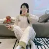 Fábrica fuente pijama nuevo de manga larga de forro polar coral para mujer otoño e invierno franela gruesa invierno conjunto para estar en casa