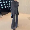 Fábrica de Suéteres Fuente Dalan: Conjunto de dos piezas de punto de estilo nuevo para principios de otoño, elegante y a la moda, con mangas de murciélago, corte holgado y efecto adelgazante