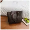 Bolso tote tejido vintage para mujer, modelo nuevo 2026, bolso de mano de gran capacidad para el trabajo con textura de piel sintética, bolso de moda para mujer al por mayor