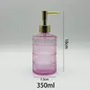 Botella dispensadora redonda de vidrio de 350 ml muy atractiva con cabezal de bomba para desinfectante de manos, gel de ducha y gel corporal