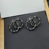 Nairwanxiang 25 Modelo Nuevo Estilo Socialité Micro-Incustados Circonita Pendientes Doble C Letra Foto Real con Etiqueta Pendientes de Mujer