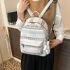 Mochila de mujer estilo casual con estampado de dibujos animados 2026, mochila ligera de doble hombro para niñas, nueva mochila versátil de gran capacidad para estudiantes