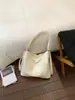 Nueva bolsa de estudiante de gran capacidad para mujer, versátil y texturizada, bolso de un solo hombro bajo el brazo, bolso de mano de cuero suave de moda