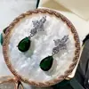 Venta directa de fábrica aretes de flor de tres pétalos con circón AAA Europa y Estados Unidos aretes exquisitos aretes de novia en stock lote mixto E6496