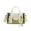 Bolsa tote redonda em bloco de cores estilo macaron coreano para atacado transfronteiriço, bolsa Boston tipo balde, bolsa transversal casual de ombro único para mulheres