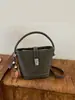 Bolso cubo estilo francés para mujer, nuevo bolso de hombro color-blocking de moda 2026, bolso de mano de nicho para el día a día, bolso pequeño cruzado para damas