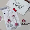 Mismo diseño que el Libro Rojo Fruta Roja y Blanca Kitty Cadena para Teléfono Móvil Sanrio Correa para Cámara Chica Linda Foto Ccd