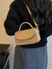Bolso pequeño cuadrado retro de alta calidad, versátil, de nicho para mujer, bandolera, bolso cruzado, bolso de mano, nuevo y moderno, transfronterizo 2026