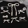 Varios accesorios de lazo de perlas, pasadores para el cabello con forma de lazo hechos a mano con cuentas, broches y accesorios para la ropa, venta al por mayor de fábrica