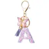 Venta Caliente Transfronteriza Az Letra de Resina Inglesa Llavero Colgante de Borla de Mariposa Morada Colgante para Bolso de Mujer