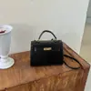 Fábrica de Bolsos para E-commerce Transfronterizo 2026 Nuevo Otoño Portátil Hebilla de Cierre Bolso Pequeño Cuadrado de Hombro Cruzado
