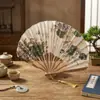 Estilo japonés transfronterizo y abanico de hueso de bambú de viento abanico pequeño exquisito para dama abanico plegable de concha con borla abanico de girasol al por mayor