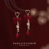Pendientes de Perlas con Lazo Rojo para Otoño e Invierno Pendientes de Alta Gama para Mujer 2025 Nuevo Estilo Chino Pendientes Rojos