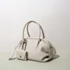 Bolso Boston de moda nicho coreano para mujer, nuevo bolso simple de hombro y bandolera, bolso de mano de lujo ligero de alta gama, bolso de bowling