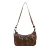 Bolsa de mano de nicho estilo coreano al por mayor, bolsa de dumplings para mujer, nuevo bolso de hombro de color sólido con correa de corbata para el otoño de 2026, bolso cruzado para el trabajo