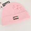 Gorro de tricô estilo coreano com laço de cordão de lã, projetado para mulheres, adequado para outono e inverno, proporcionando calor e proteção para as orelhas, e ideal para estudantes