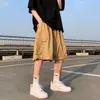 Shorts casuais de trabalho de comprimento médio com bolso grande para homens, novo estilo moderno, shorts versáteis de cor sólida, corte solto e perna larga