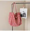 Bolsa de Lona Artística Casual de Gran Capacidad 2025 Primavera Nueva Estilo Coreano Rayas Moda Bolso de Mano Bolso de Hombro