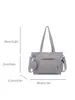 Nuevo bolso de lona para mujer de principios de otoño de 2026, bolso tote versátil para el trabajo, bolso de hombro de gran capacidad para la escuela, bolsos de mujer al por mayor