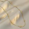 Colar Minimalista de Aço Titânio Japonês e Coreano Feminino Corrente de Cobra com Contas de Transferência Ins Corrente para Clavícula de Feijão Dourado Retro Joia de Nicho de Alta Qualidade