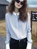 Elegante top de estilo francés con un toque de lujo ligero y alta gama, adecuado para ocasiones importantes, una camisa a rayas única y hermosa para mujeres en primavera