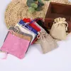 En stock tela imitación lino bolsa de bolsillo de texto pulsera de juego bolsa de embalaje de almacenamiento bolsa de almacenamiento de carga para auriculares bolsa antipolvo para joyas