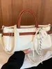 Bolso de mano de diseño de nicho transfronterizo elegante, bolso de hombro con patrón de lichi de lujo ligero vintage, bolso cruzado simple de moda para el día a día