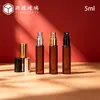 Botella de spray de fondo grueso de 5 ml para productos transfronterizos nuevos, botella de perfume redonda de color té, botella de spray pequeña mate de color té, botella de recarga de perfume de vidrio