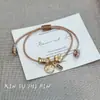 Pulsera tejida de Flor de la Suerte de Gato Baguette Francés Nuevo Estilo Chino Linda Moderna de Alto Valor Exquisita Versátil Accesorio de Mano para Mujeres