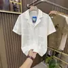 Camisa de estilo playero japonés con cuello cubano hueco para hombre, stock de fábrica, chaqueta camisa casual retro de manga corta para verano
