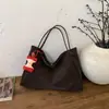 Transfronterizo 2026 Nuevo Modelo Simple para Viajes Cotidianos Retro Popular Bolso Tote Gran Capacidad Bolso de Hombro para Mujer Bolso de Alta Gama para Debajo del Brazo