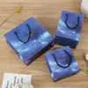 Em estoque saco de papel céu estrelado criativo bolsa de mão requintada estilo ins saco de presente azul simples saco de presente para roupas