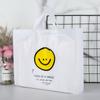 Linda bolsa de tienda de ropa con cara sonriente, bolsa de regalo, tienda de ropa para niños y niñas, bolsa de plástico portátil, embalaje de caja de zapatos, logotipo al por mayor