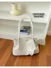 Comercio exterior Patrón tejido texturizado de viajero europeo y americano 2026 nuevo popular retro de gran capacidad bolso de hombro tipo tote debajo del brazo
