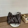 Bolsa de Palha Transfronteiriça Super Popular para o Verão 2026 Novo Modelo Grande Capacidade Bolsa de Ombro Nicho Casual Elegante Bolsa Tote