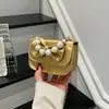 Bolso de hombro de moda para niñas estilo coreano, lindo bolso de mano con lazo y perlas, nuevo bolso cruzado infantil con cadena 2026