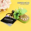 Llavero creativo de dinosaurio de juguete para morder a mano, muñeco de dibujos animados, bolso de estudiante, colgante de descompresión, pequeño regalo al por mayor