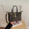 Bolso para Mujer 2026 Nuevo Modelo Nicho Rayas Mezclilla Forma de Dumpling Retro Simple Bolso de Mano Gran Capacidad Bolso de Hombro