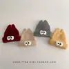 Gorro de inverno infantil, quente e espesso, com um design engraçado apresentando olhos grandes, estilo de puxar e proteção para as orelhas, adequado para meninos e meninas, e estiloso